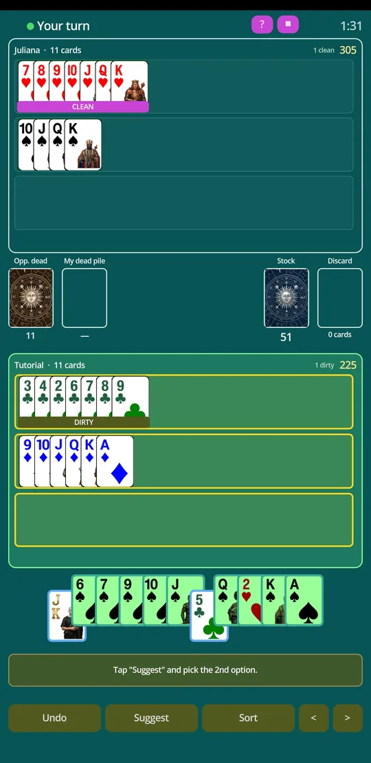 A table with a dirty canasta marked and the player's hand